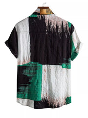 Green, black and white color-block button-up shirt shown from the back