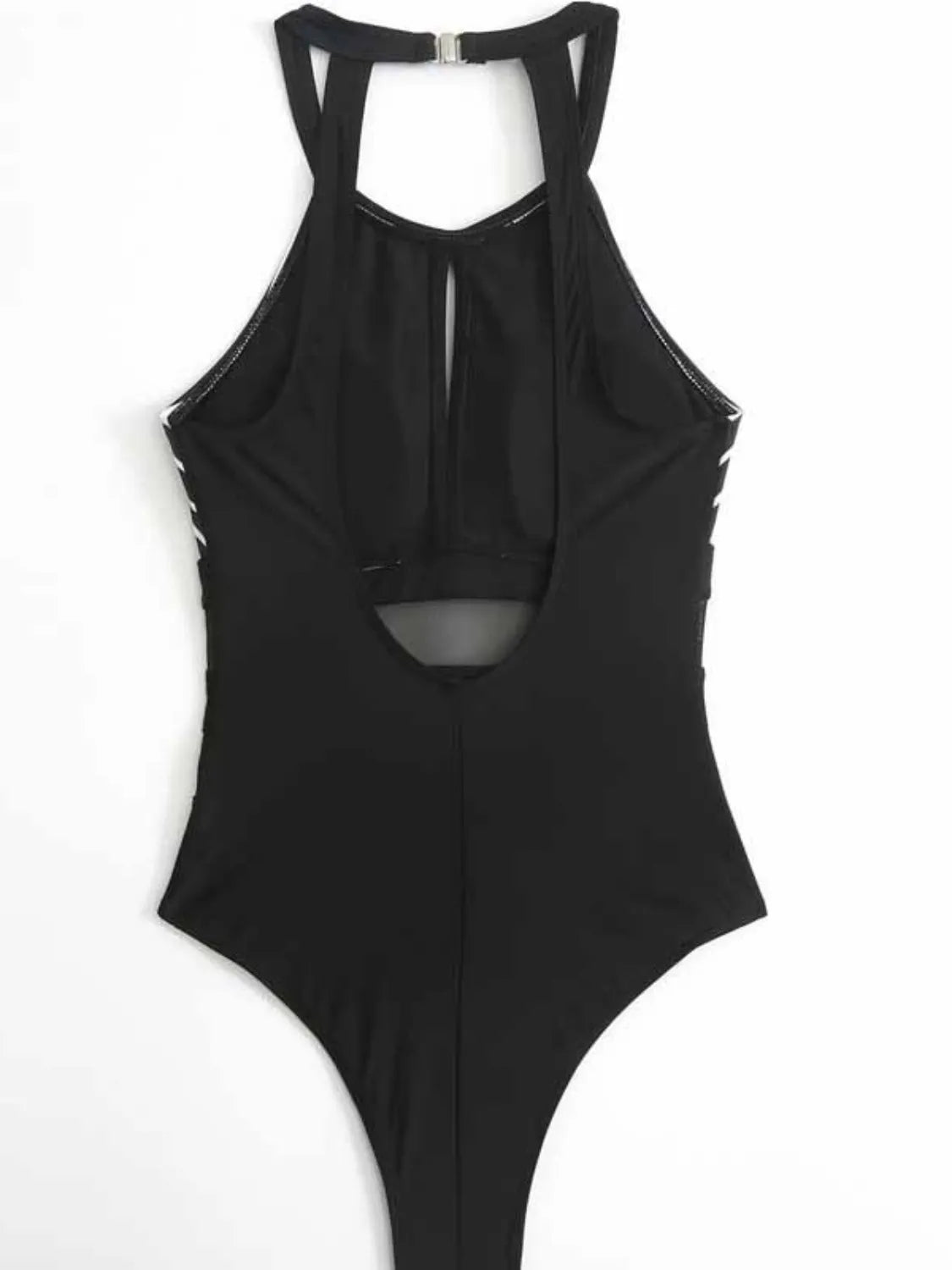 Black open-back one-piece swimsuit laid flat, back view