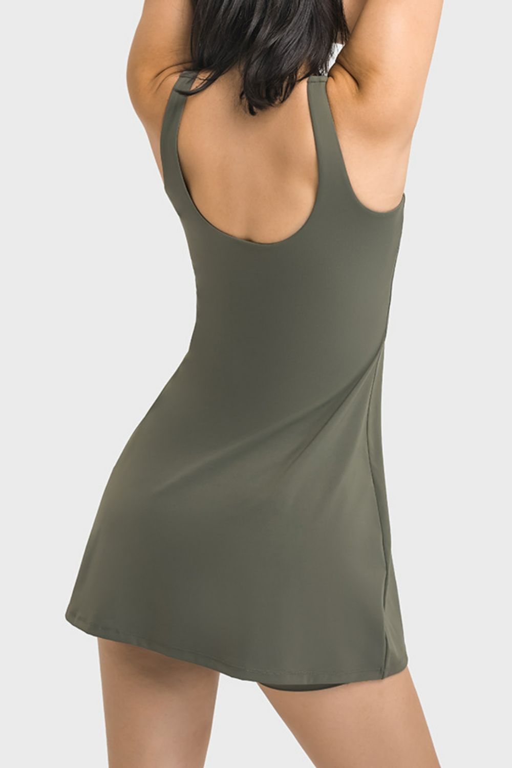 Back view of the olive sports dress with a low scoop back.