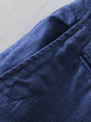 Close-up of blue shorts fabric and pocket