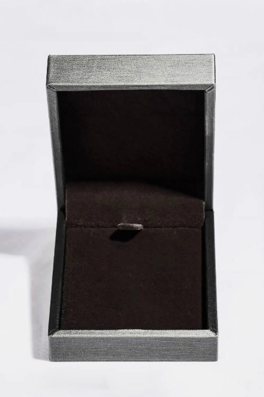 Open black jewelry box with rectangular pendant necklace inside