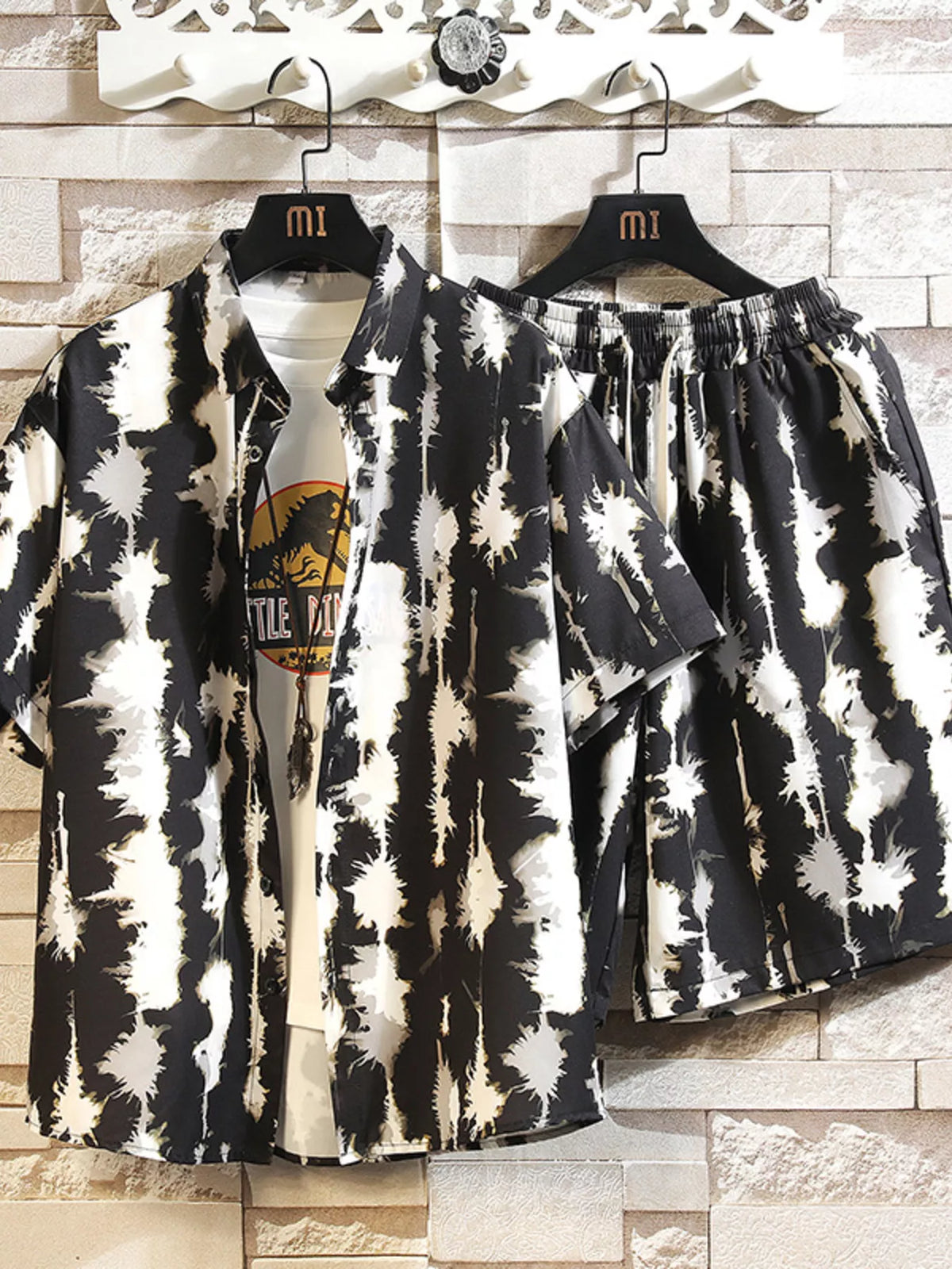 Black-and-cream abstract print button-up shirt and matching shorts set, front view