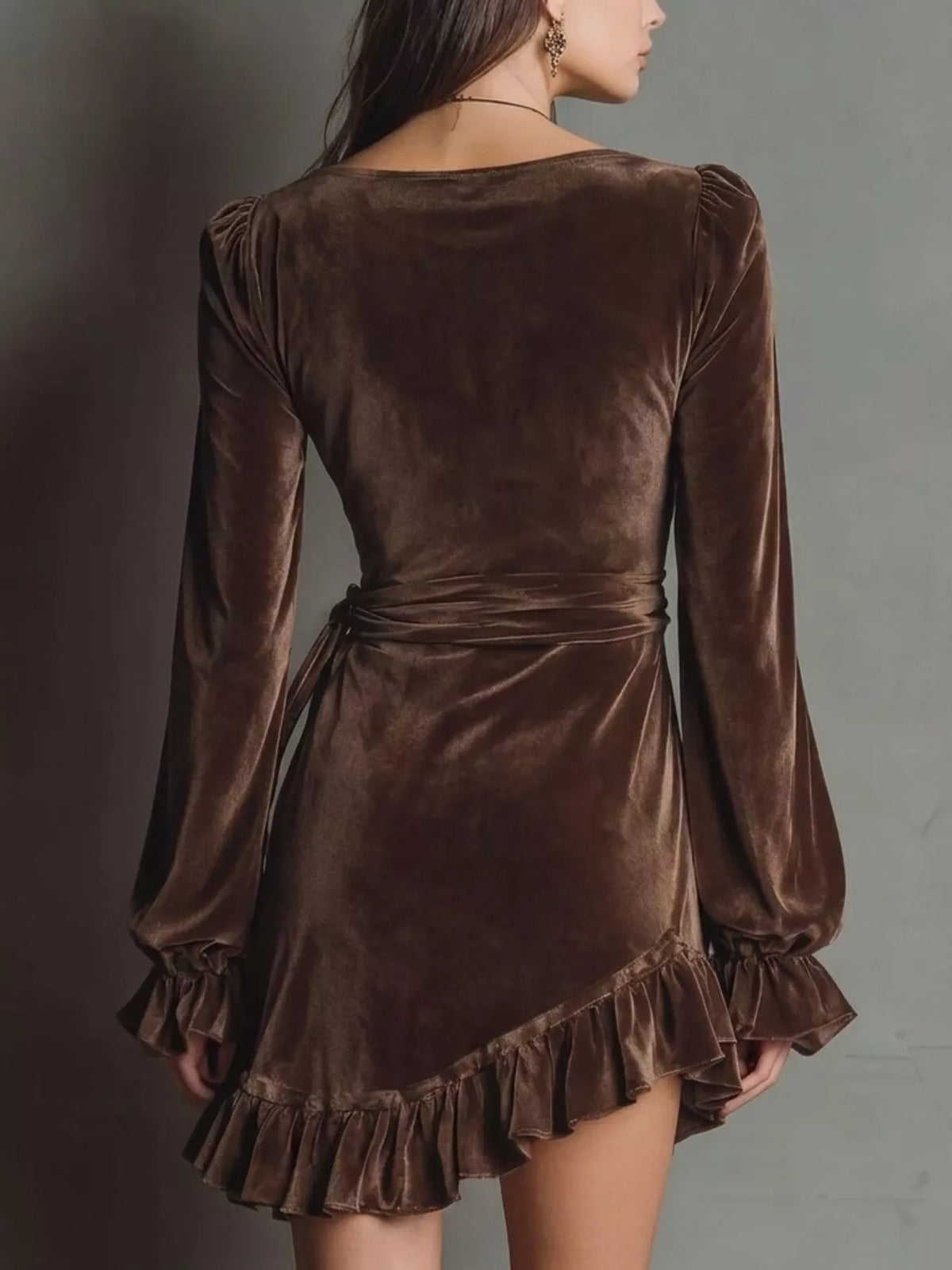Back of brown velvet-look dress with ruffled hem
