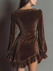 Back of brown velvet-look dress with ruffled hem