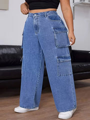 Three-quarter view of light blue cargo jeans showing the layered side pockets and wide hems.