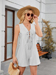 Ivory tie-front romper styled with straw hat