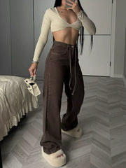 Front view of brown high-waisted wide-leg jeans with long tie belt