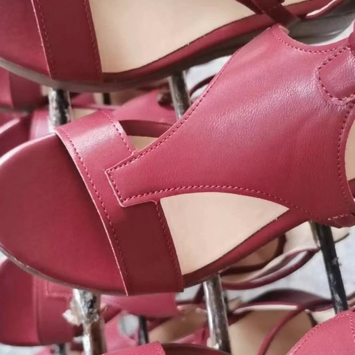 Close view of pink wedge sandal straps and open toe