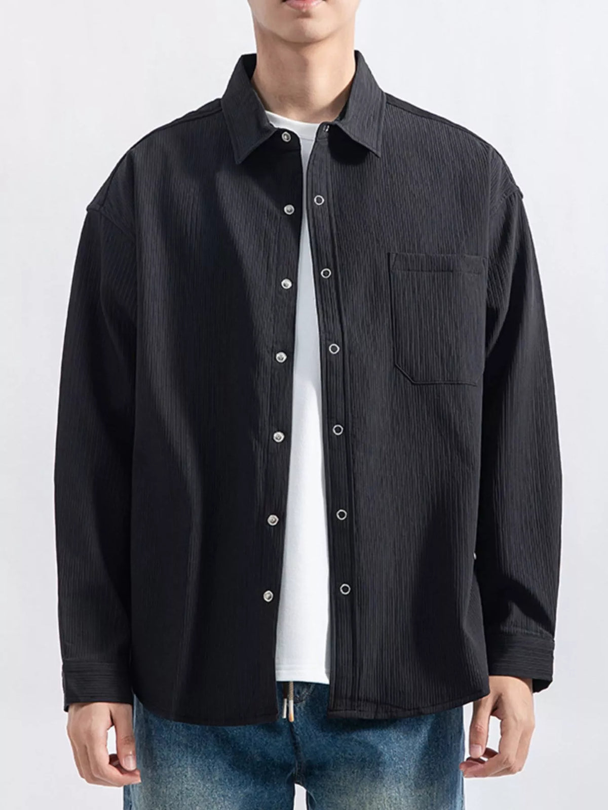 Close view of the shirt's vertical textured fabric and button placket