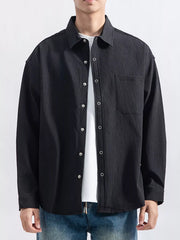 Close view of the shirt's vertical textured fabric and button placket