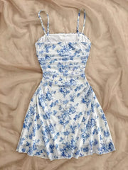 Blue floral spaghetti-strap mini dress laid flat, full front