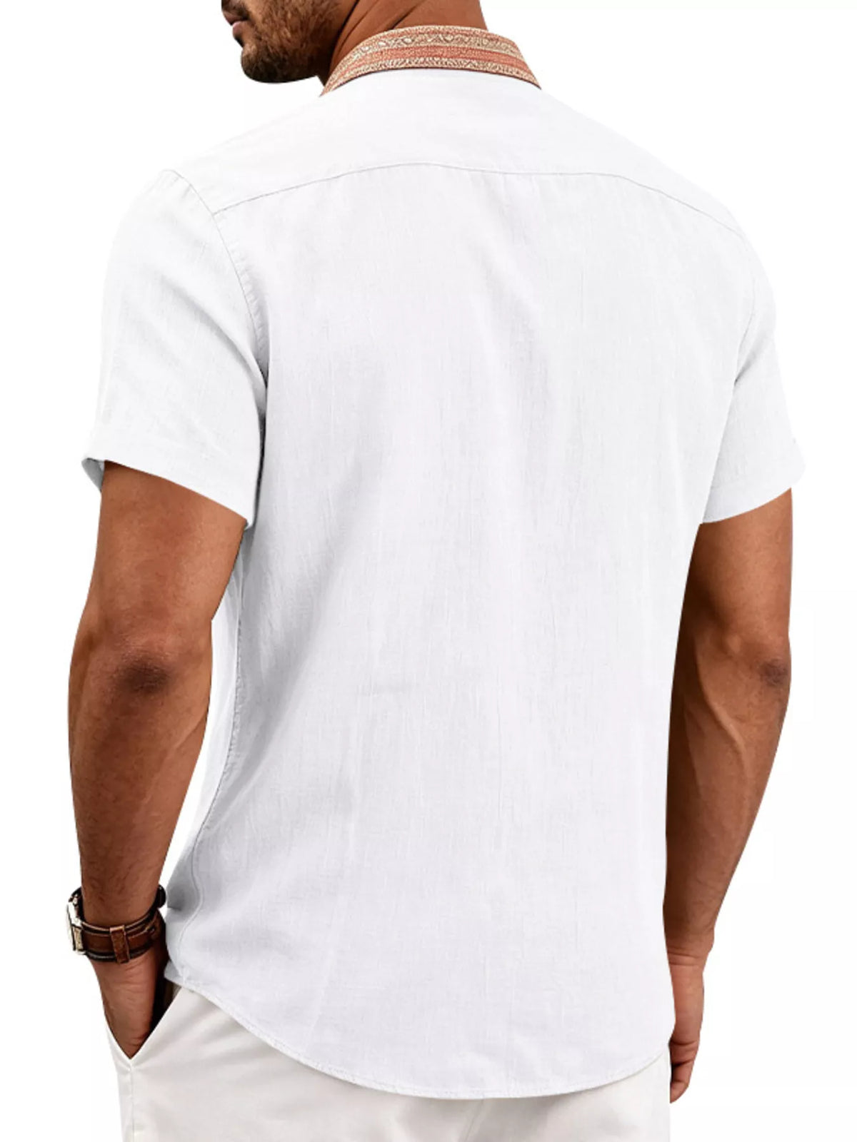 Model wearing navy shirt showing front placket and curved hem