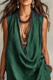Close front view of green sleeveless dress with draped neckline