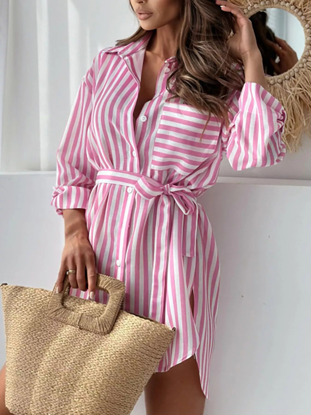 Back view of pink striped shirt dress with a waist tie.