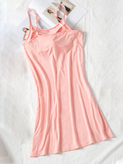 Blush pink cami dress shown full length with slim straps and gently flared skirt