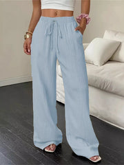 Front view of light-blue wide-leg pants with tied drawstring waist