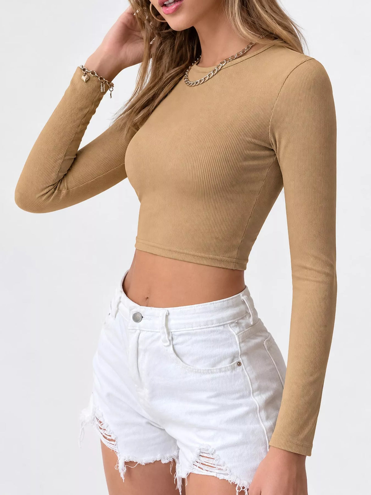 Tan long-sleeve cropped top shown from the front