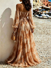 Rear view of the brown off-shoulder dress showing its waist bow and flowing hem