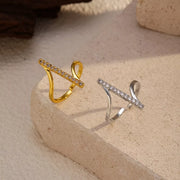 Gold-tone and silver-tone rings displayed together on stone