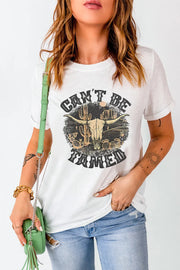 Model wearing white Cant Be Tamed graphic T-shirt, front view