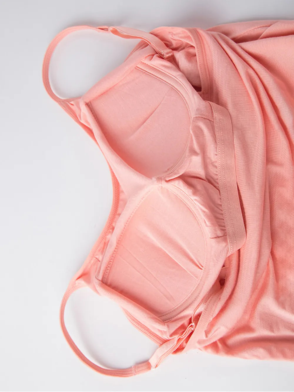 Close view of the blush cami dress's built-in bra cups and adjustable straps