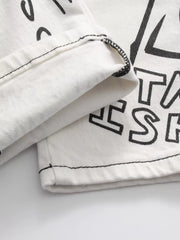 Close-up of folded edge and printed white denim