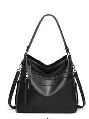 Black multi-pocket handbag shown from the front with two shoulder straps and zip pockets
