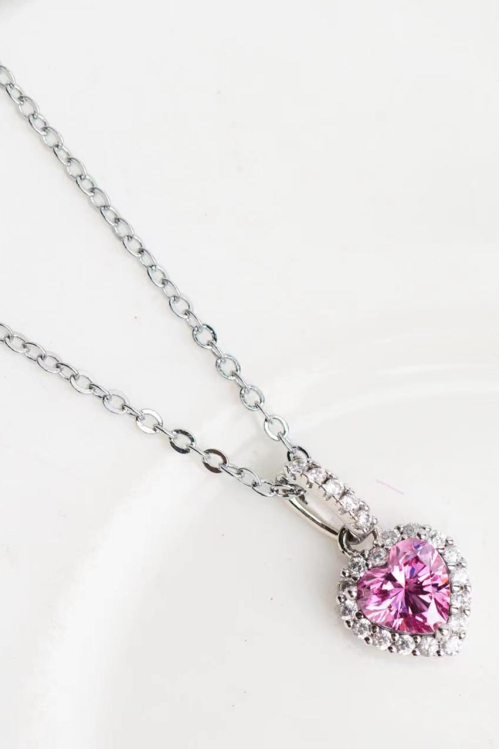 Pink heart-cut moissanite pendant on a fine silver-tone chain