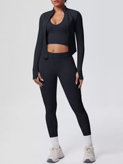 Close view of garment details of tank & zip-up jacket and leggings three-piece active set