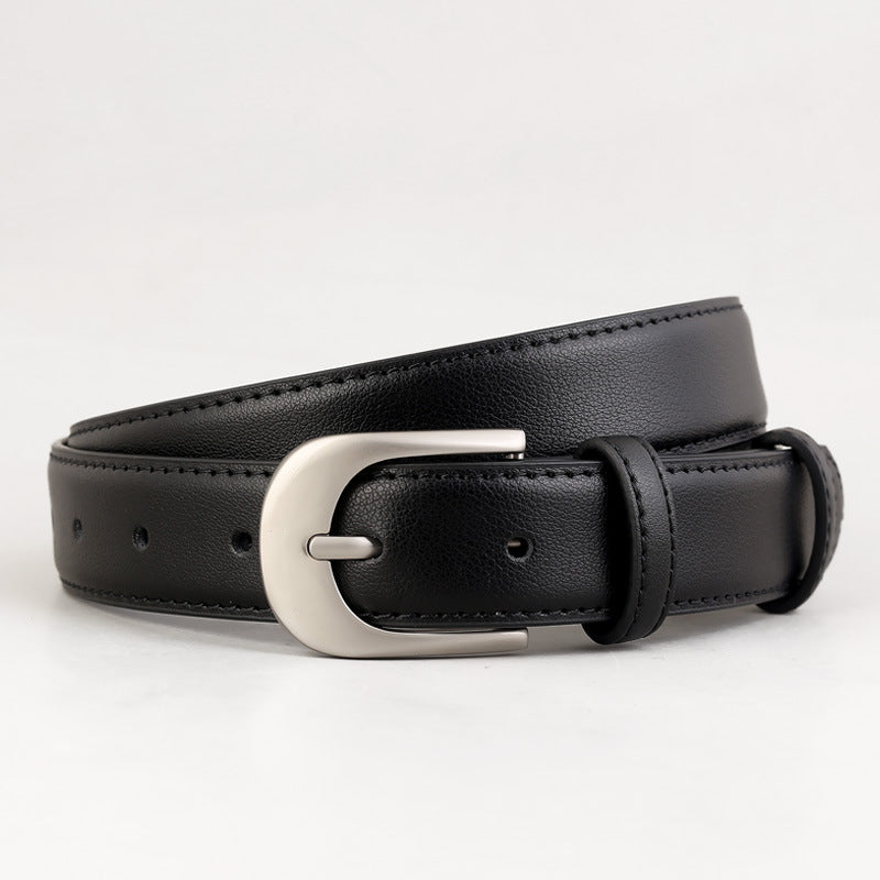 Black stitched belt with rounded silver-coloured pin buckle and two keepers, rolled close-up