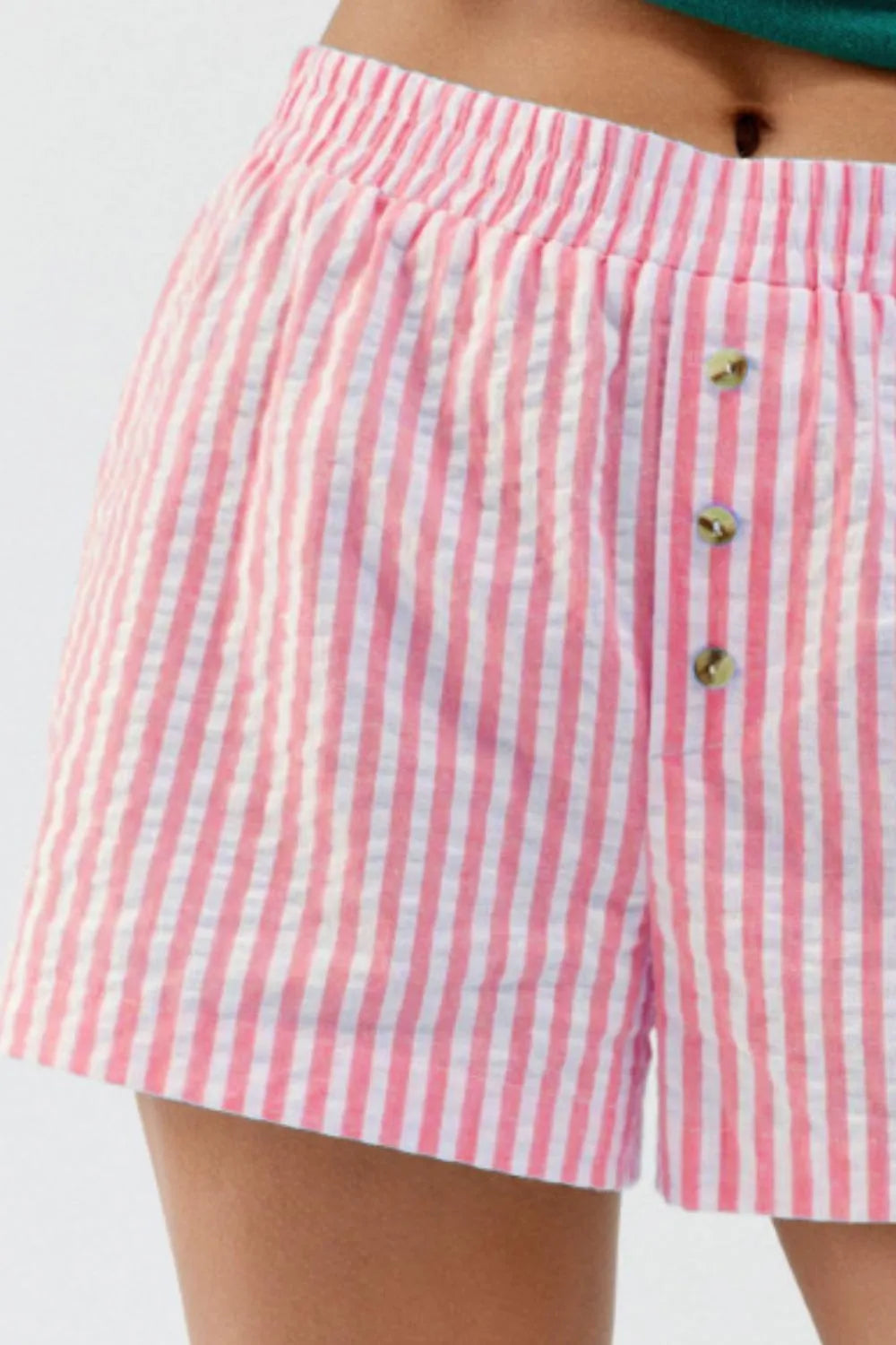 Close-up of rose pink vertical stripes and leg opening