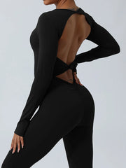 Black jumpsuit open back and twisted waist detail