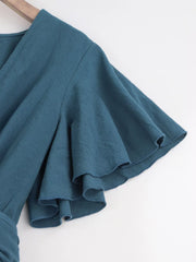 Close-up of haze blue flutter sleeve