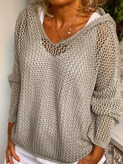 Taupe open-knit V-neck hooded cover-up with long sleeves, worn over a white top.