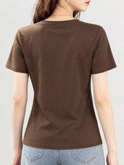 Back view of brown short-sleeve T-shirt worn with jeans.