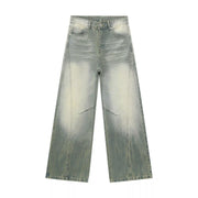 Light-wash wide-leg jeans laid flat with faded thigh details