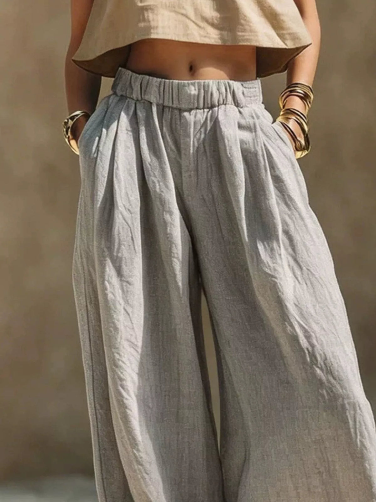 Front view of gray wide-leg pants showing the relaxed fit and elastic waist