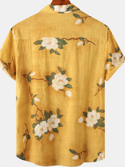 Back of mustard-yellow shirt with scattered cream floral print