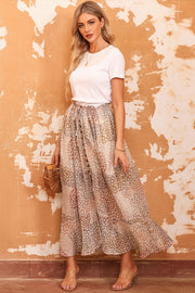 Angled view of floral midi skirt with flowing tiered hem