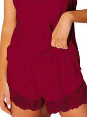 Close-up of burgundy lounge shorts with scalloped lace hems and gathered waistband