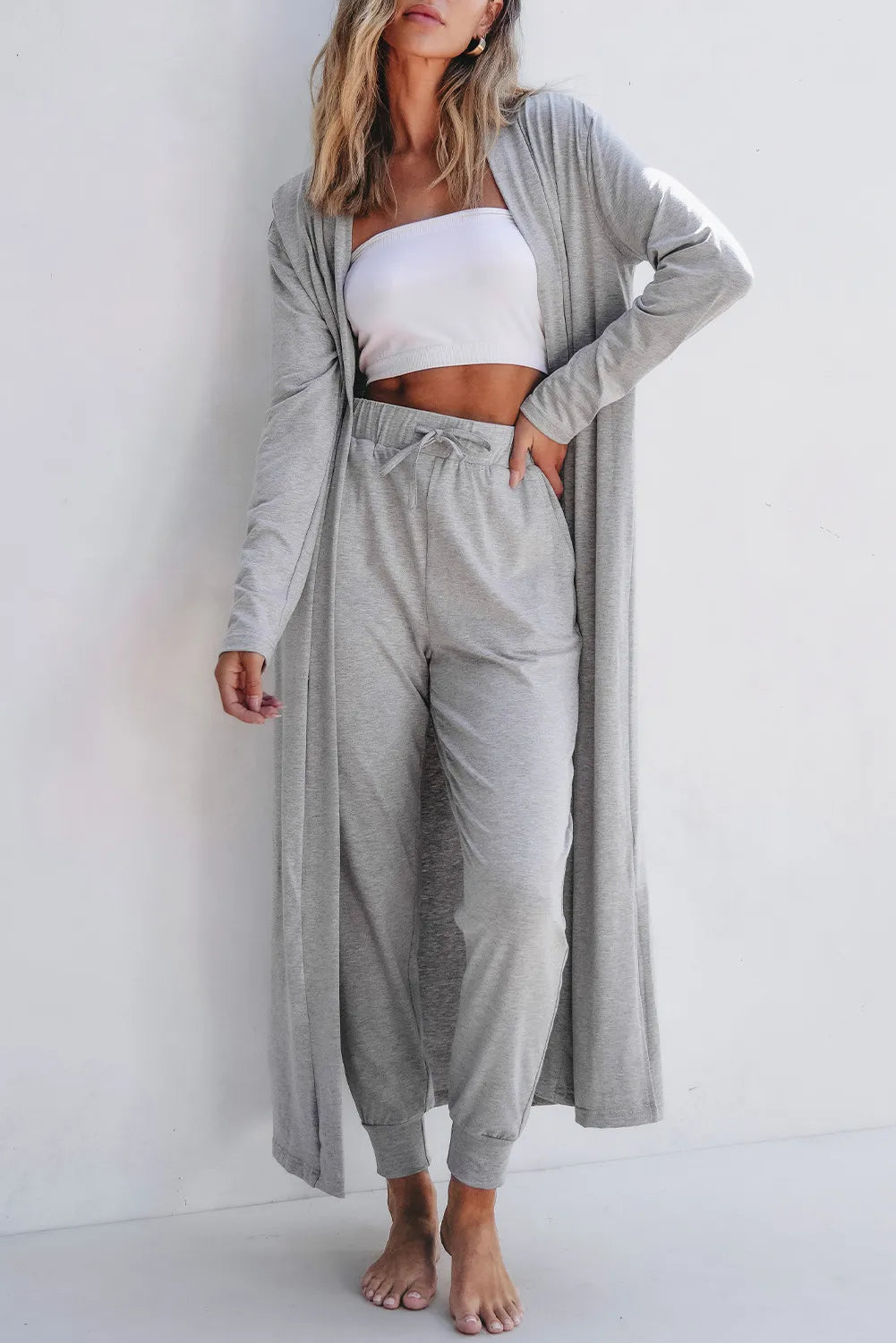 Front view of model wearing gray open-front cardigan with matching lounge pants