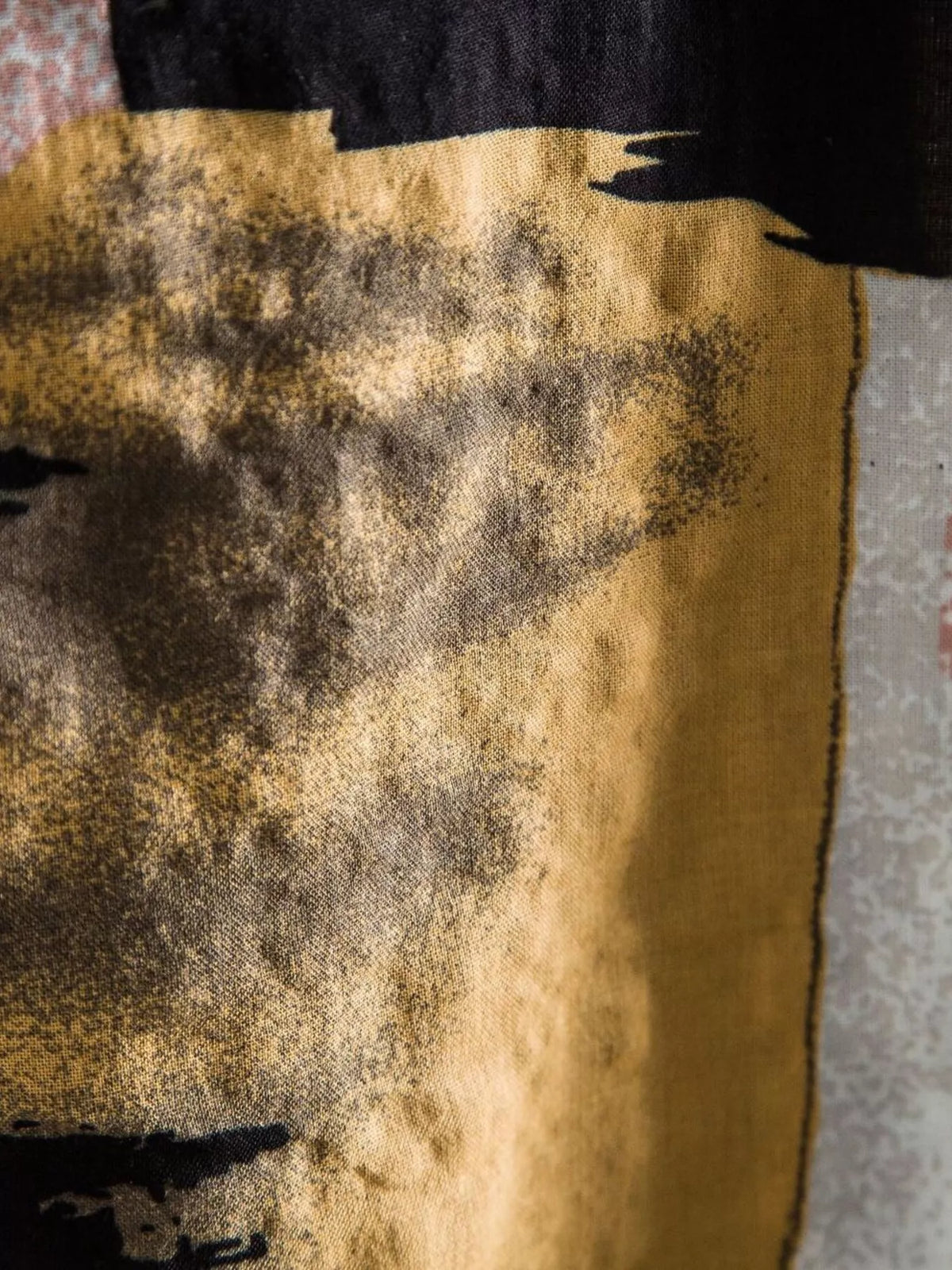 Close-up of the ochre and black shirt fabric