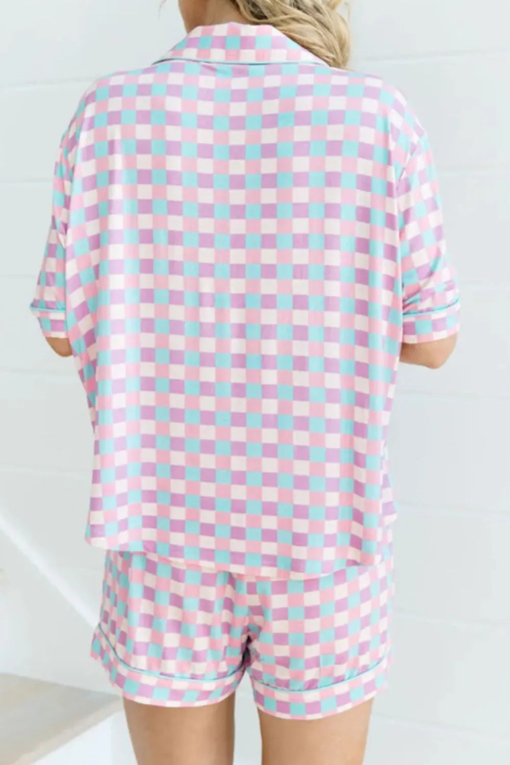 Back view of pink-and-white plaid short-sleeve top and shorts set