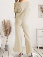 Cream wide-leg lounge pants shown from the waist down