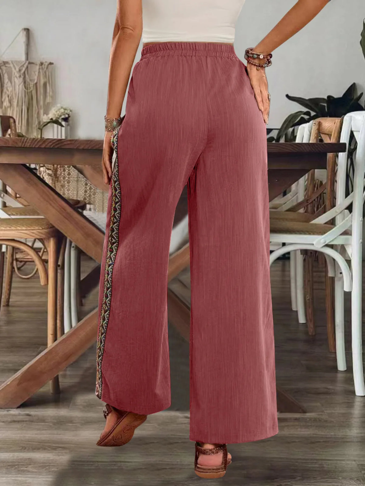 Back view of dusty rose pants and wide legs