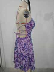 Side view of the lavender sequin mini dress on a dress form, showing its open lace-up back.