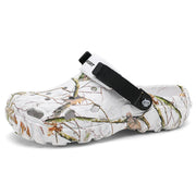 White branch-print clog with a black instep strap and ventilation holes
