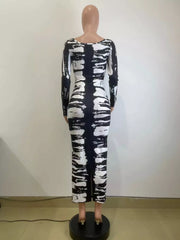 Back mannequin view of black and white tie-dye long-sleeve dress