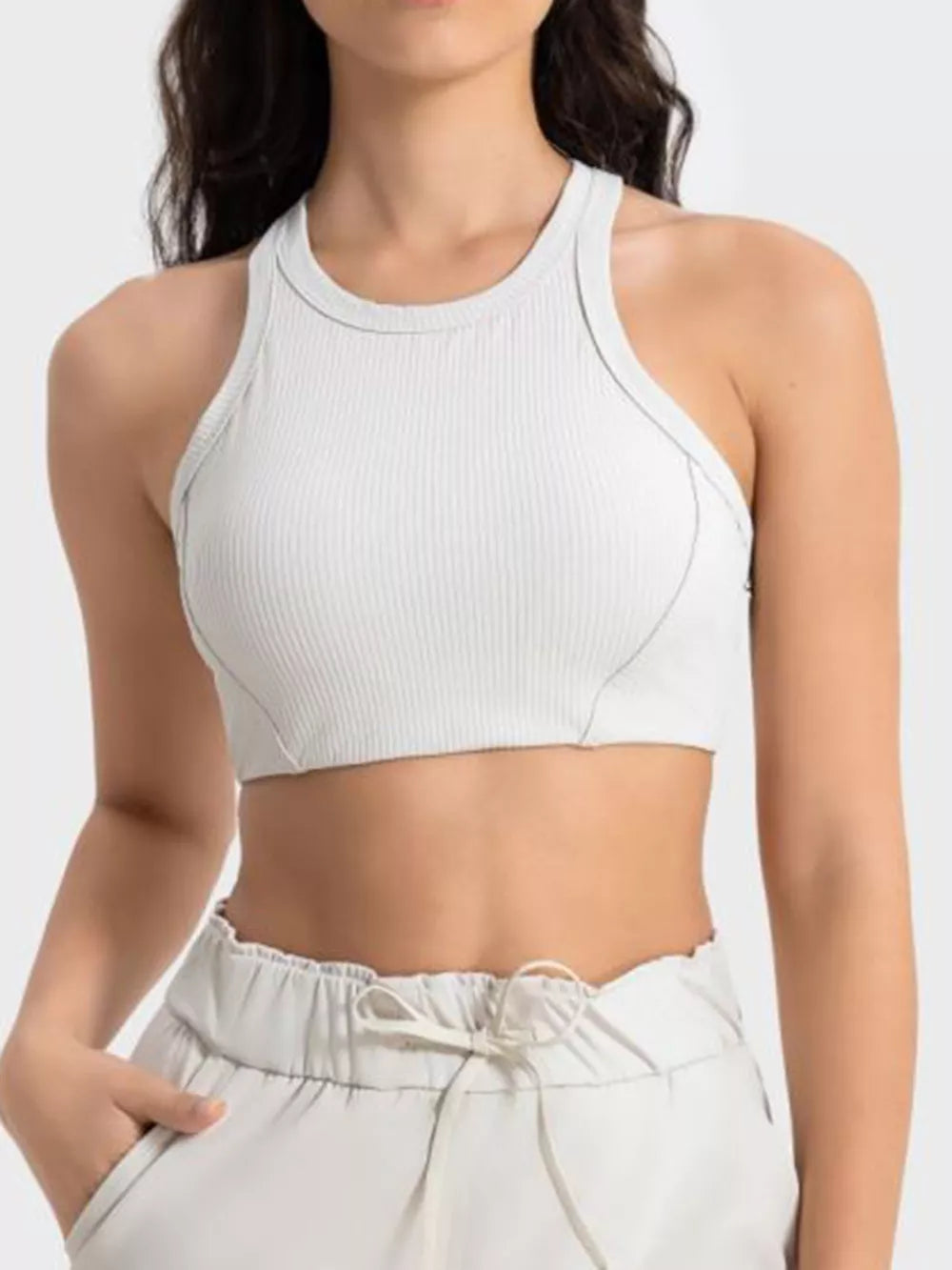 White cropped athletic tank with wide straps, front detail