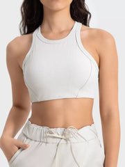 White cropped athletic tank with wide straps, front detail